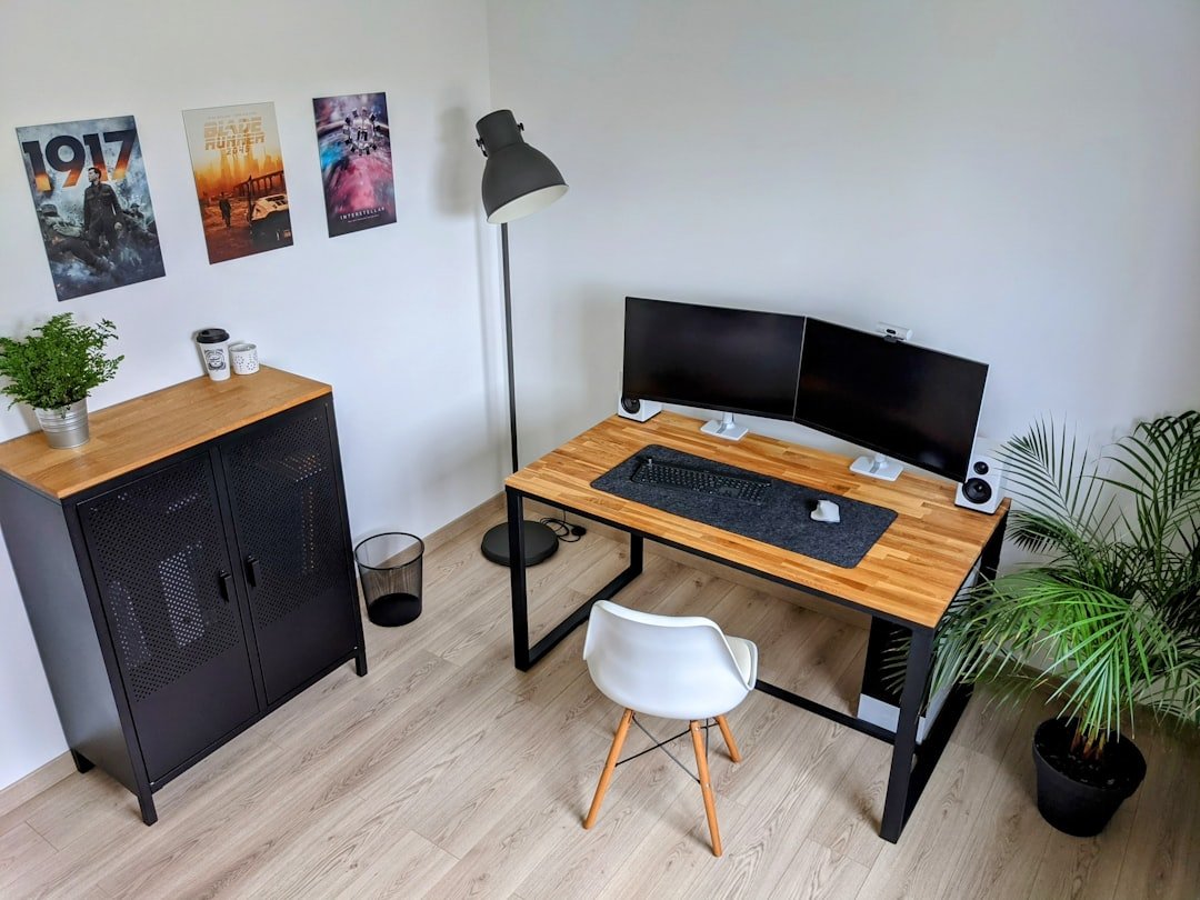 Cozy apartment workspace with laptop and coffee showing long-term travel stay setup