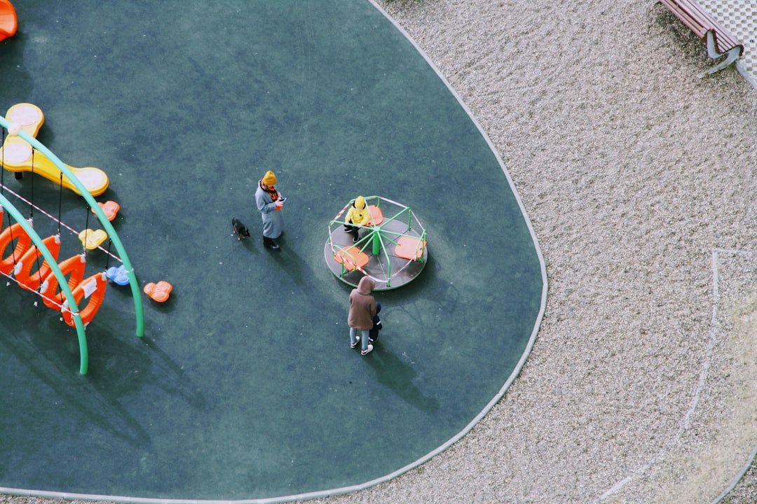 Family relaxing at a hotel pool with children playing in shallow water