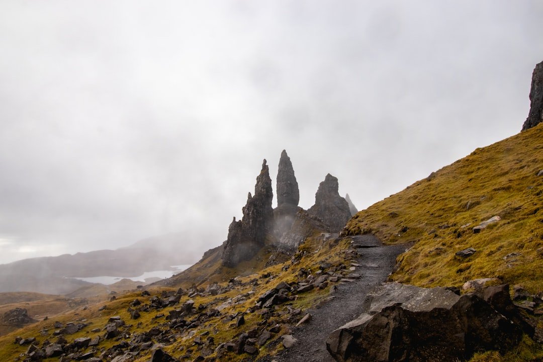 Split image showing Torres del Paine granite towers on left and Icelandic highlands volcanic landscape on right